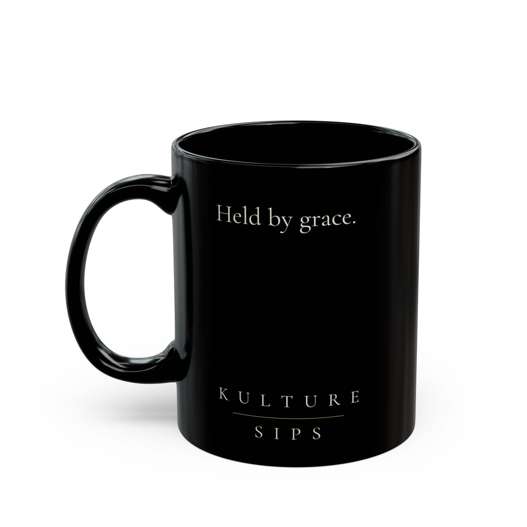 Carried Grace Collection black ceramic mug with “Held by grace” message and Kulture Sips branding