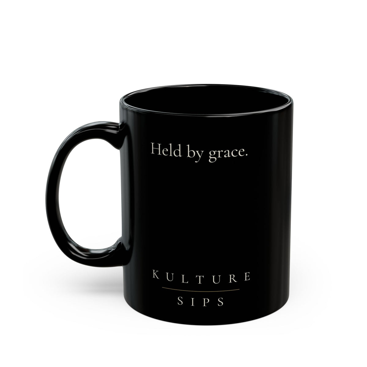 Carried Grace Collection black ceramic mug with “Held by grace” message and Kulture Sips branding