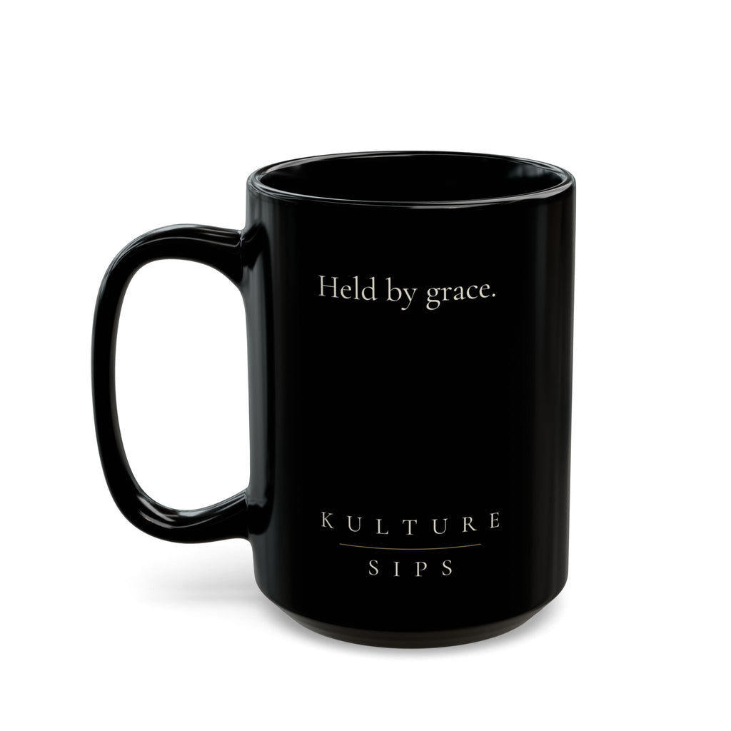 Carried Grace Collection black ceramic mug with “Held by grace” message and Kulture Sips branding