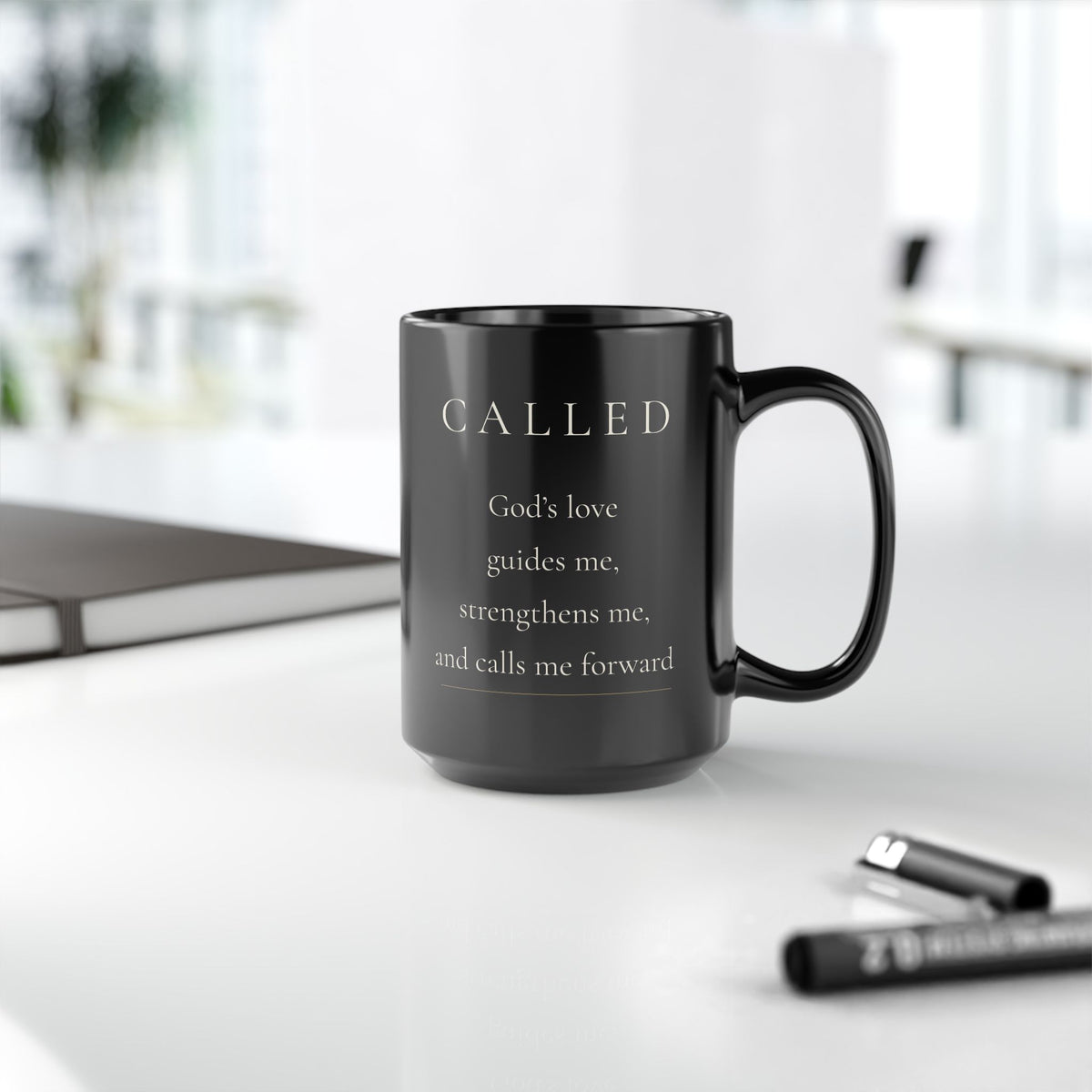 Called Grace Collection black ceramic mug on desk with front affirmation visible